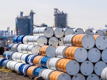 Industry oil chemical metal barrels stacked up in waste yard of tank and container, Kawasaki city near Tokyo Japan