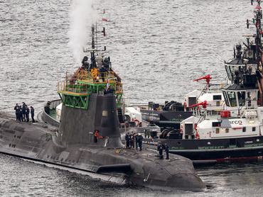 FASLANE, SCOTLAND - MARCH 04: A submarine is manoeuvred at His Majesty's Naval Base Clyde on March 04, 2025 in Faslane, Scotland. His Majesty's Naval Base (HMNB) Clyde, also known as Faslane, hosts the UK's nuclear submarines which are armed with Trident missiles and serve as the UK's nuclear deterrent. Last week Scotland's First Minister John Swinney backed Prime Minister Keir Starmer's plan to increase defense spending to 2.5 per cent of GDP by 2027, but defended his party's opposition to the Trident nuclear missile system, which had an annual running cost estimated at 6% of the defence budget in 2023-24. (Photo by Jeff J Mitchell/Getty Images)